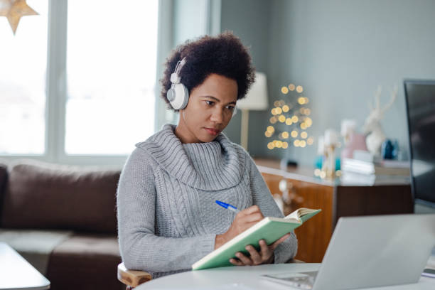 istock African-American attends an online course at home 1356540157