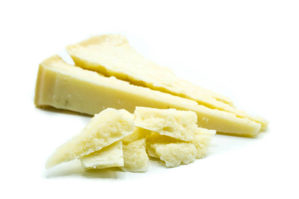 istock Piece of parmesan cheese isolated on white background 1356540222