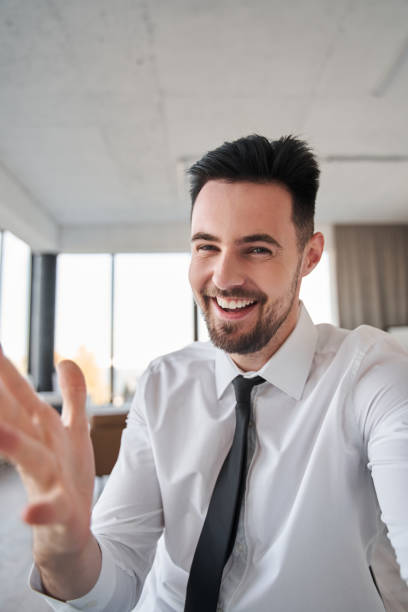 istock Businessman discussing something with colleagues while having video call 1356543146