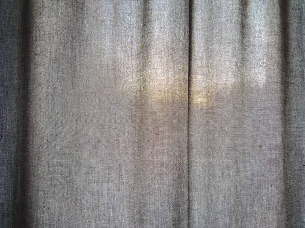 istock A dark fabric with the sun in the background. 1356543412