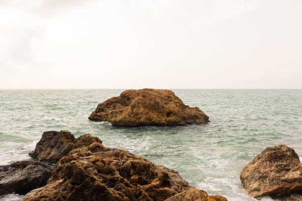 istock Amazing seascape and rocky beach 1356543444