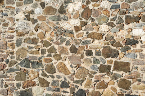 istock Close Up texture of stones placed with cement. 1356544582