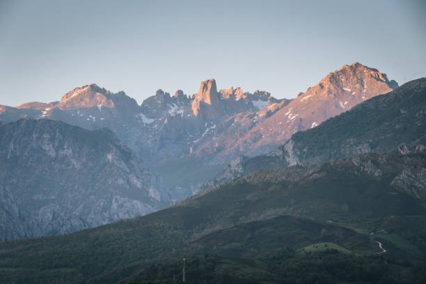 istock Scenic view of mountain range at sunrise 1356545099
