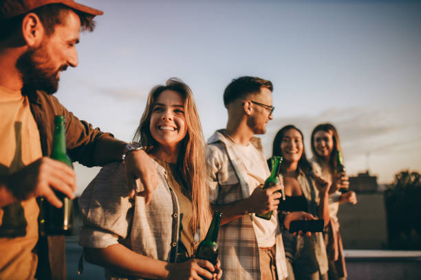 istock Happy friends enjoying in conversation on a roof. 1356546566