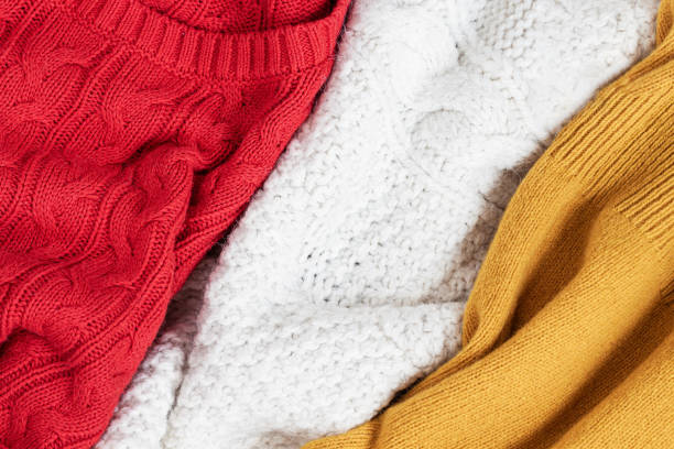 istock Close-up of multicolored warm knitted things. Top view 1356546690