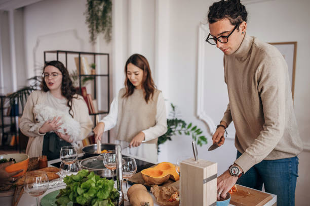 istock Friends making lunch together 1356547787