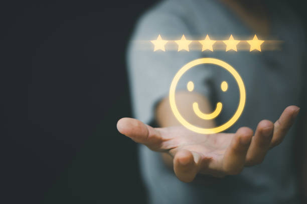 istock Businessman holding and select smiley face icon for customer feedback rating and evaluation concept. 1356549039