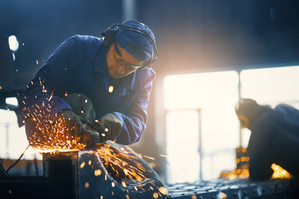 istock Caucasian man welding metal construction on factory 1356549195