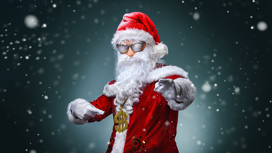 X-mas lottery win credit bank present for noel. Funky crazy hipster white bearded santa claus hold money fan show horned symbol enjoy deposit gift wear red hat isolated yellow color background