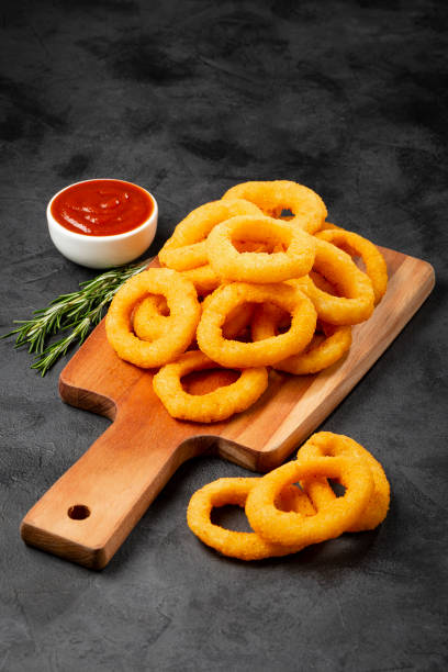 istock Crispy onion rings with ketchup. 1356551806