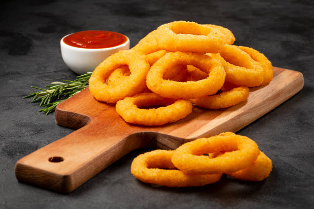 istock Crispy onion rings with ketchup. 1356551866