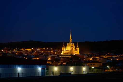 Night view of the town of San Carlos del Valle with the middle ages church of Santo Cristo illuminated with artificial lights, Ciudad Real province, Castilla la Mancha region, Spain, Europe