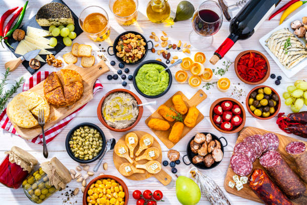 istock Spanish tapas, beer and wine on white table 1356554209