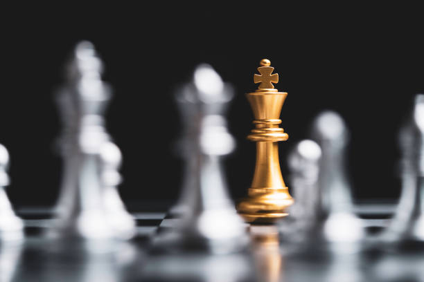 istock Golden king chess encounter with silver chess enemy on dark background and connection line for strategy idea and futuristic concept 1356554349