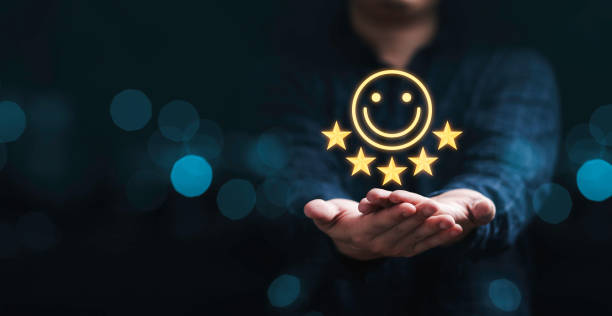 businessman holding smile icon for the best evaluation , customer satisfaction concept. - kunskap bildbanksfoton och bilder
