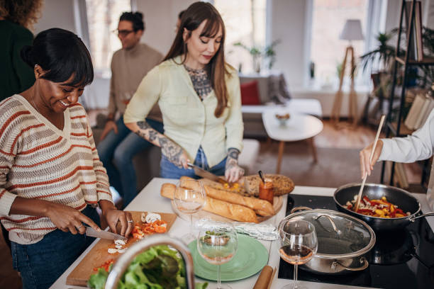 istock Women preparing a meal 1356554931