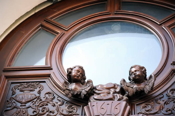 Round window wooden frame with angels figures