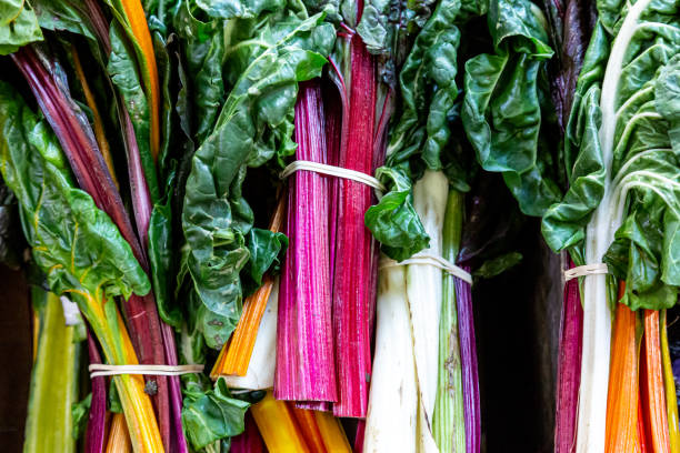 istock Colourful rainbow chard for sale on a market stall 1356555592