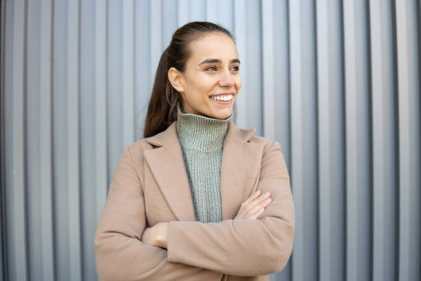 istock Young businesswoman standing looking away 1356556197