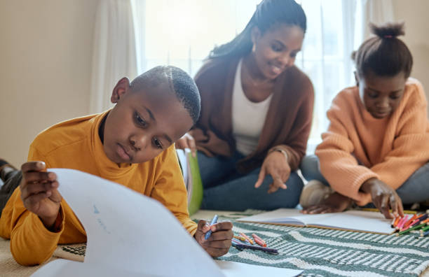 istock Shot of a young boy completing his school work at home 1356557007