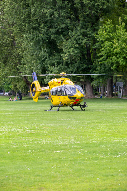 German rescue helicopter Christoph 77 of ADAC air rescue service Wiesbaden, Germany - July 10, 2021: German rescue helicopter Christoph 77 of ADAC air rescue service in a recreational park in the city center of Wiesbaden, Germany adac stock pictures, royalty-free photos & images