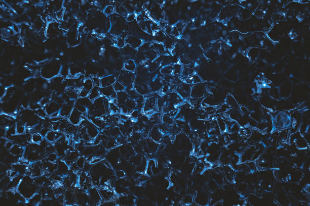 istock Abstract porous background. Mesh uneven surface. Macro 1356557779