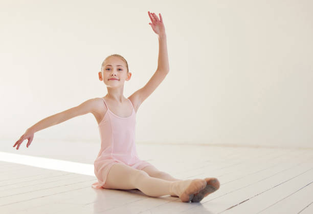 istock Shot of a young ballerina dancing in a studio 1356557873