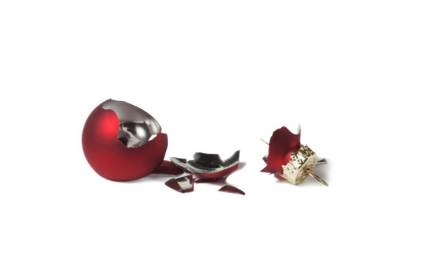 istock Broken red christmas ball isolated on white background. 1356560190