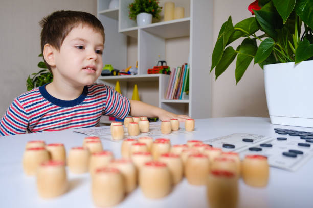 istock A 4-year-old boy plays loto, studies numbers using a board game. 1356560360