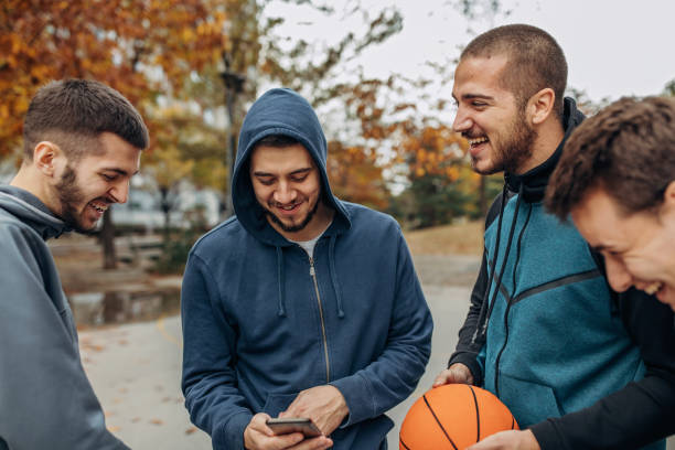 istock Friends playing basketball outside 1356561888