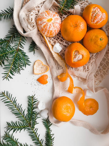 Christmas still life with tangerines and spruce branch