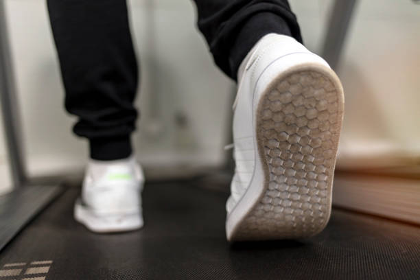 istock Fit man running on treadmill in the gym...... 1356563145