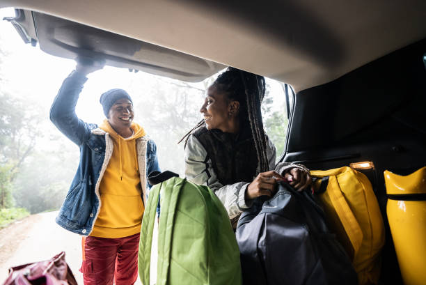 istock Friends getting backpack from car trunk for a hiking 1356564909