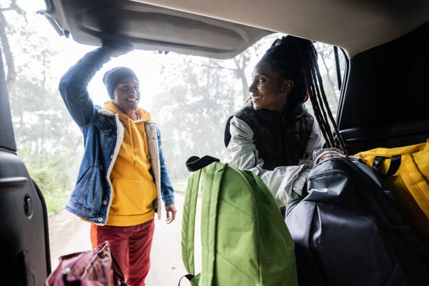 istock Friends getting backpack from car trunk for a hiking 1356564938