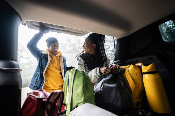istock Friends getting backpack from car trunk for a hiking 1356564979