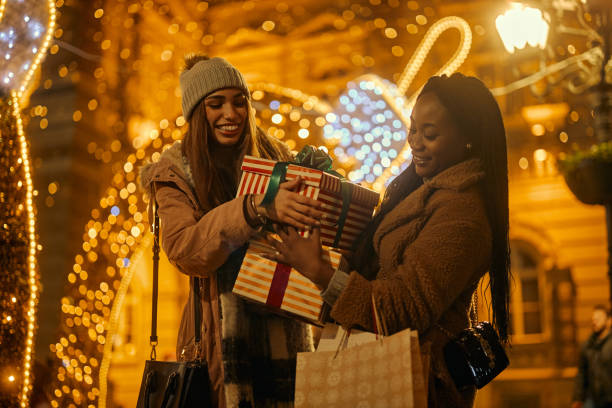 istock Two beautiful women at winter shopping 1356566347