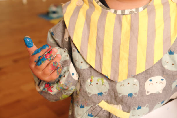 istock Early childhood development activity: finger painting at home 1356566527