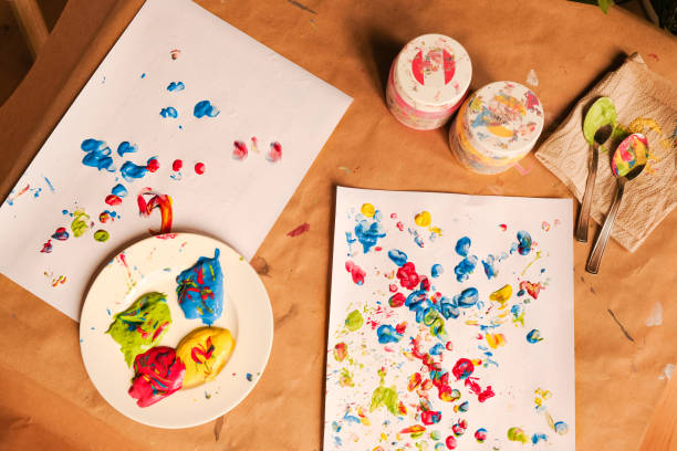 istock Early childhood development activity: finger painting at home 1356566553