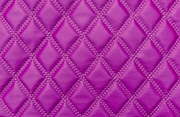 istock Purple faux leather texture with stitching 1356567109
