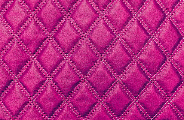 istock Pink faux leather texture with stitching 1356567115