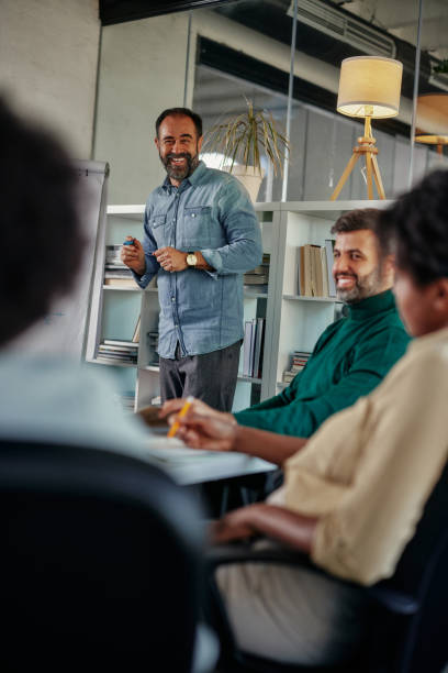 Diverse businesspeople at business meeting in boardroom