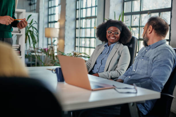 istock Multiracial businesspeople having a meeting in an office 1356568477