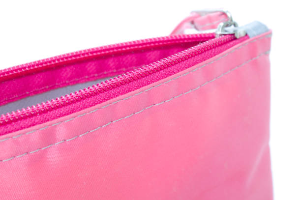 istock Pink bag with zipper and white background 1356571309