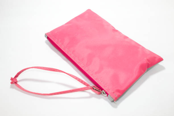 istock Pink bag with zipper and white background 1356571310