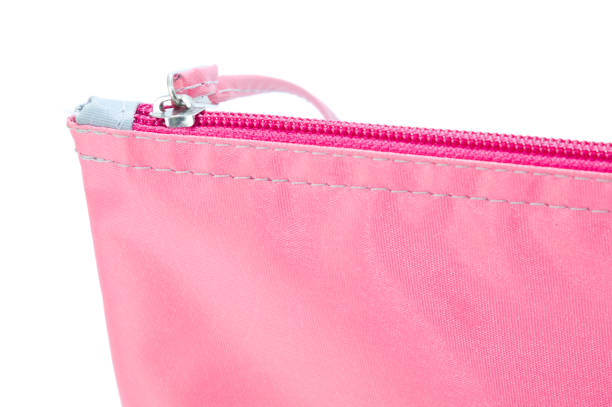 istock Pink bag with zipper and white background 1356571319