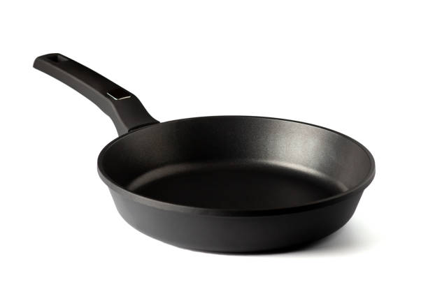 istock Frying pan with non-stick coating isolated on white background. New kitchen utensil cookware. Close up 1356572111