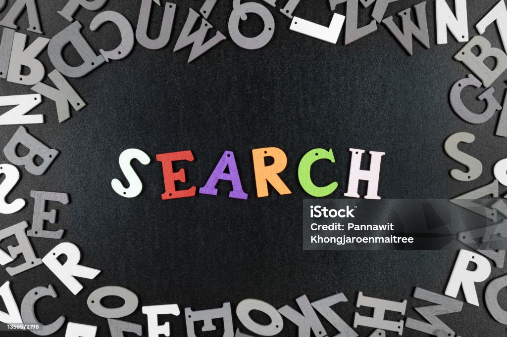 Search font with text or message colorful on wooden black backgrounds. Search font with text or message colorful on wooden black backgrounds textures board. Searching Stock Photo