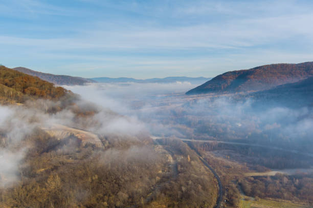 istock Amazing nature scenery the mountains under mist in the morning 1356572354