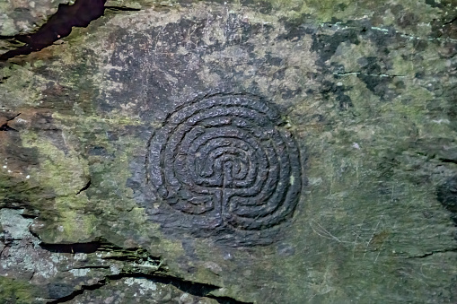 Bronze age carvings in stone in Rocky Valley, Tintagel.  Rocky Valley, Tintagel, Cornwall, UK.