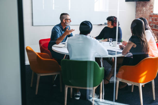 istock Creative businesspeople having a discussion in a meeting room 1356572490